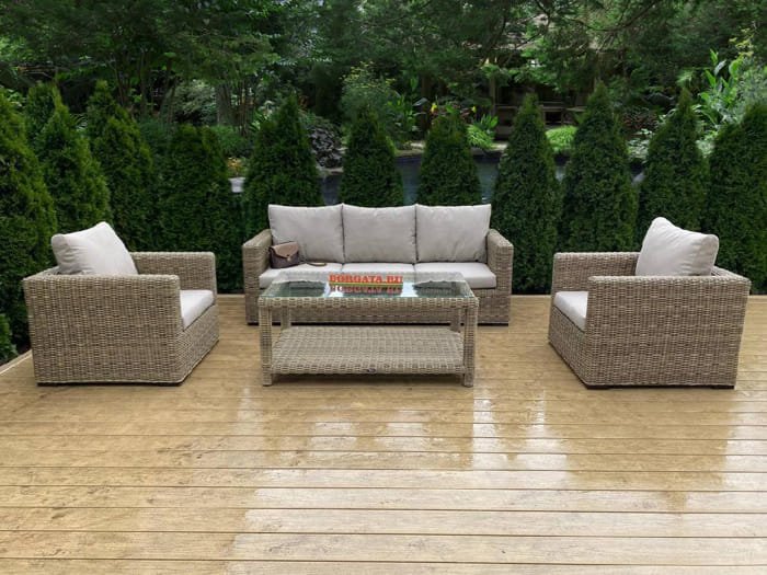 Grey outdoor sofa with coffee table on tiled terrace
