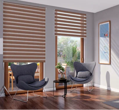 Wooden-toned zebra blinds in a sunlit sitting area with black chairs