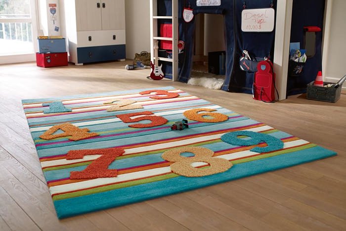 Colorful play rug with ocean theme, featuring fish, crabs, and sea creatures.