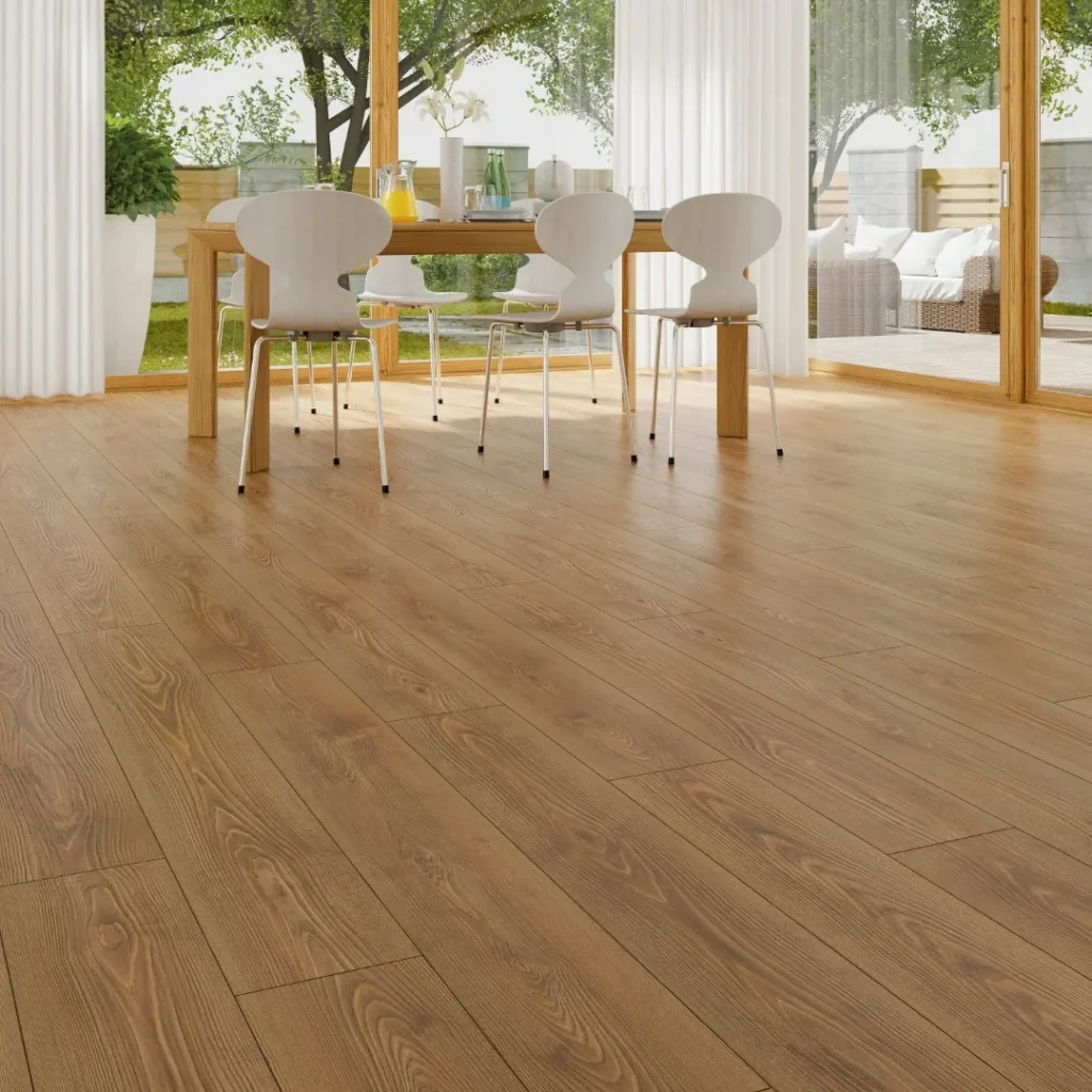Spacious room with natural wood flooring and large windows allowing sunlight to pour in.