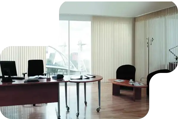 Modern office with large windows covered by vertical blinds for sunlight control