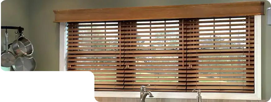 Elegant premium wooden blinds installed in a modern Dubai living room for a stylish and warm interior.