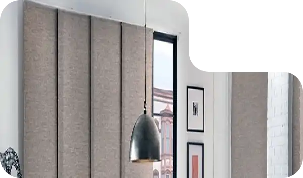 Wide window panel blinds in neutral tones enhancing a Dubai living room.