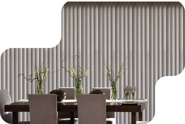 Made-to-measure vertical blinds installed on large windows in a Dubai office space.