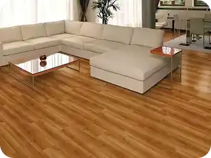 Modern living room with PVC wood-effect flooring and a beige sectional sofa.