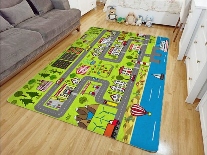 Colorful kids play rug with city road map, cars, and buildings for imaginative play.