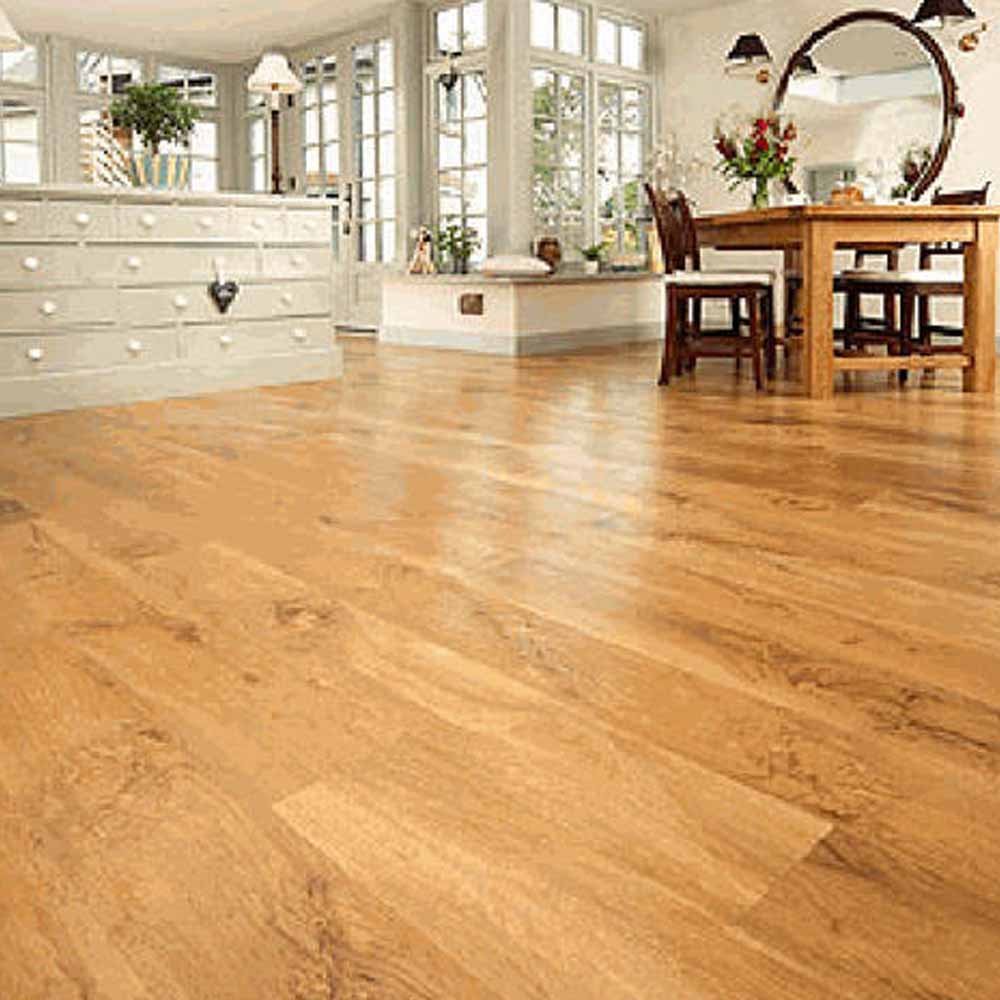 Elegant dining area with glossy honey-toned wood flooring and classic white furniture.