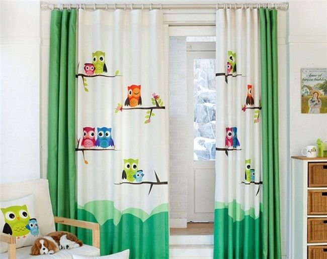 Green and white curtains with mixed cartoon designs in a creative kids' space
