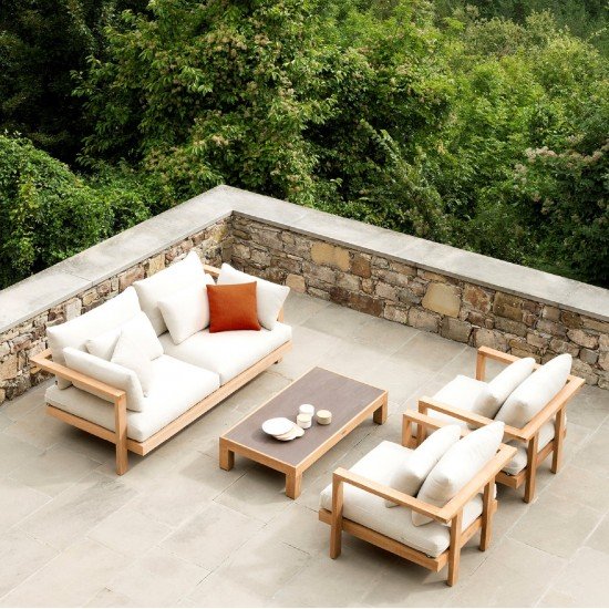 Rooftop setup with L-shaped outdoor sofa in neutral colors