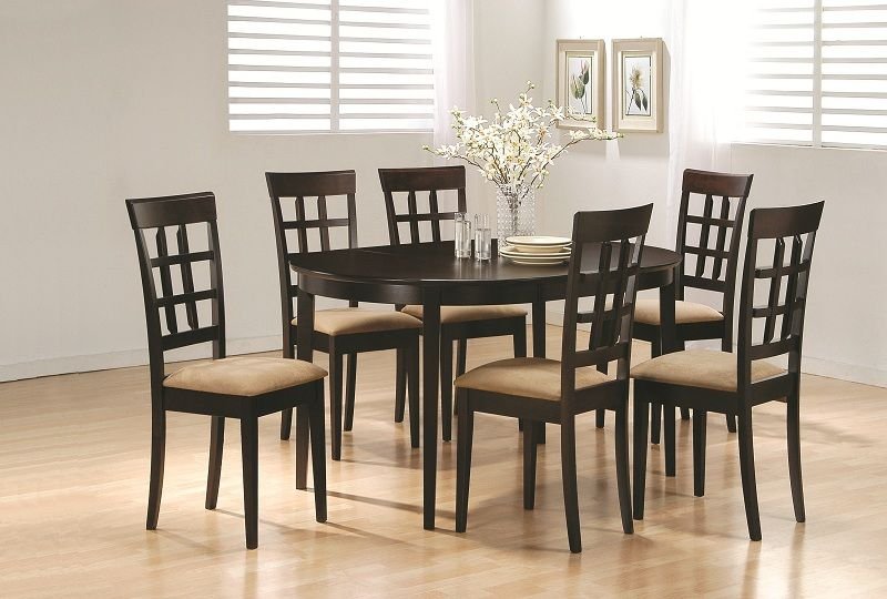 Classic black wooden dining table set with six matching slat-back chairs.