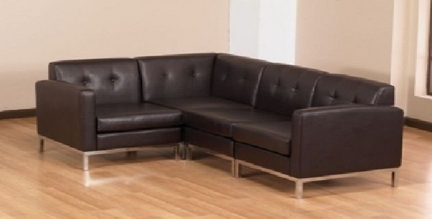 Compact L-shaped sofa with storage and pull-out bed function.