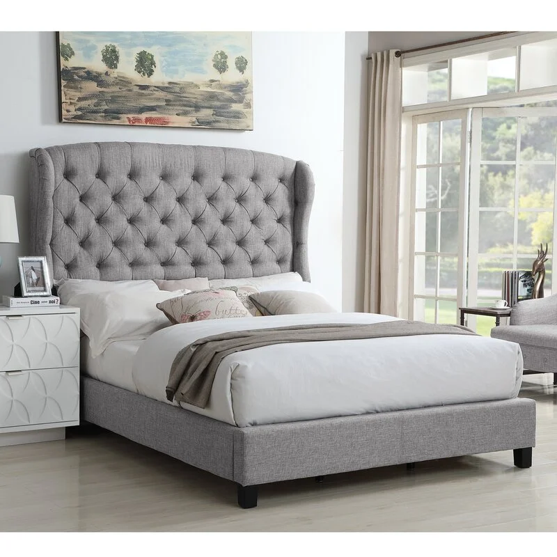 Modern upholstered bed with tufted headboard in a luxury bedroom.