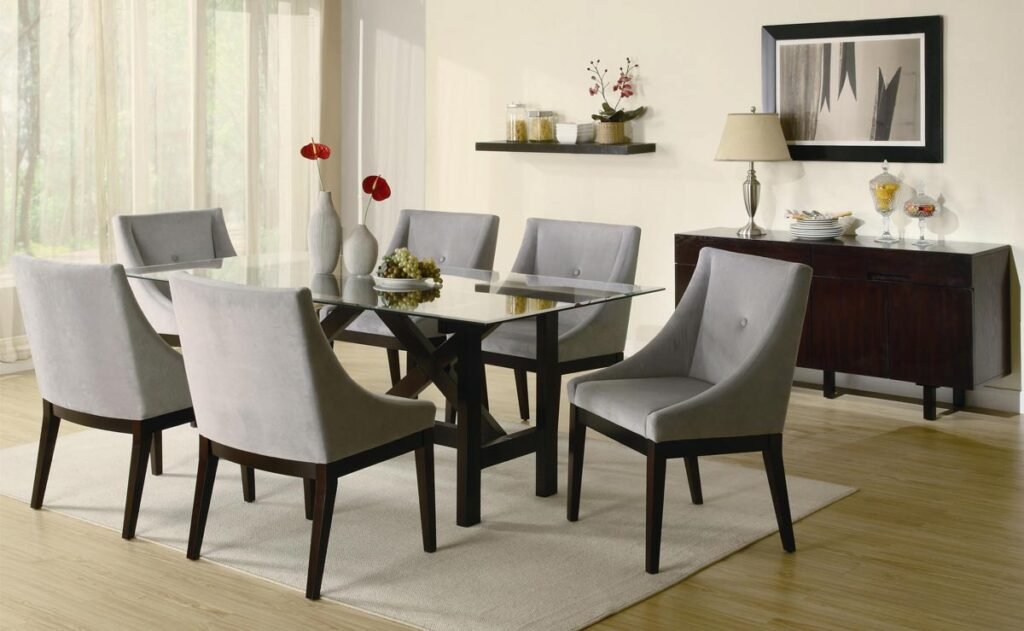 Compact black dining table with beige cushions and modern design.
