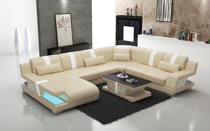 Cream-colored U Shape sofa set with dark cushions and central rug