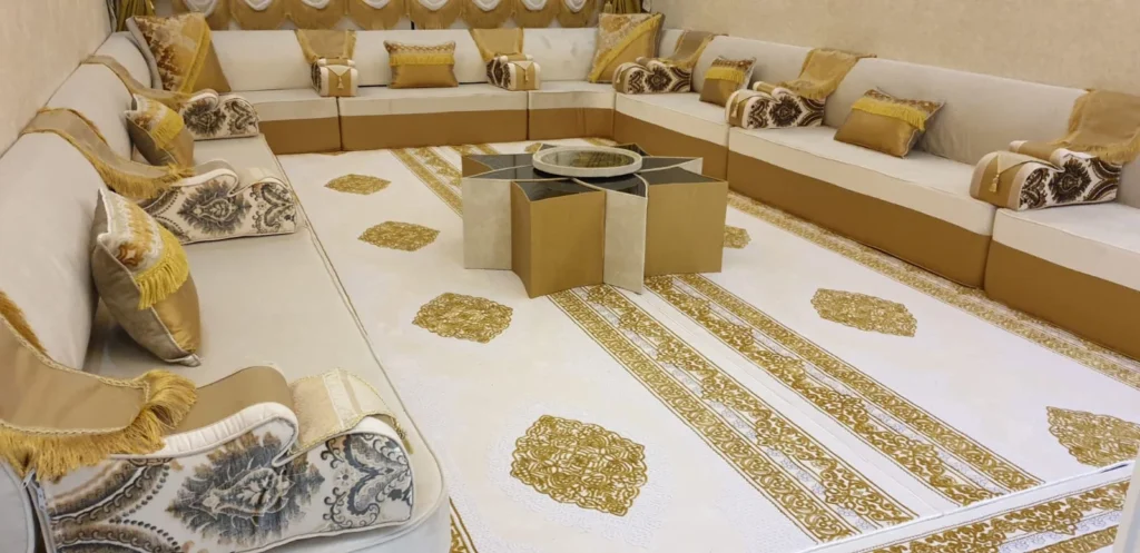 Luxurious majlis with gold accents and central coffee table