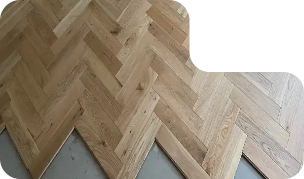 Warm-toned brown herringbone wooden flooring design for stylish Dubai interiors.
