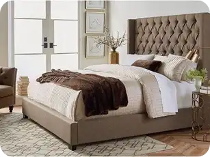 Queen size upholstered bed with cushioned headboard for cozy interiors.