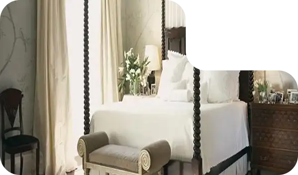 Contemporary canopy bed with sleek black finish and modern décor.