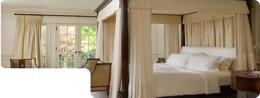 Rustic canopy bed in natural wood for cozy bedroom interiors.