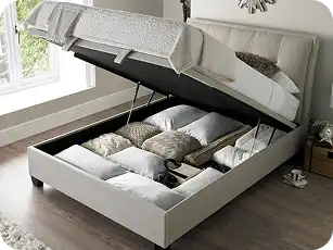 Space-saving storage bed with built-in drawers for clothes and bedding.