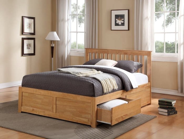 Wooden queen storage bed with side drawers for extra organization.