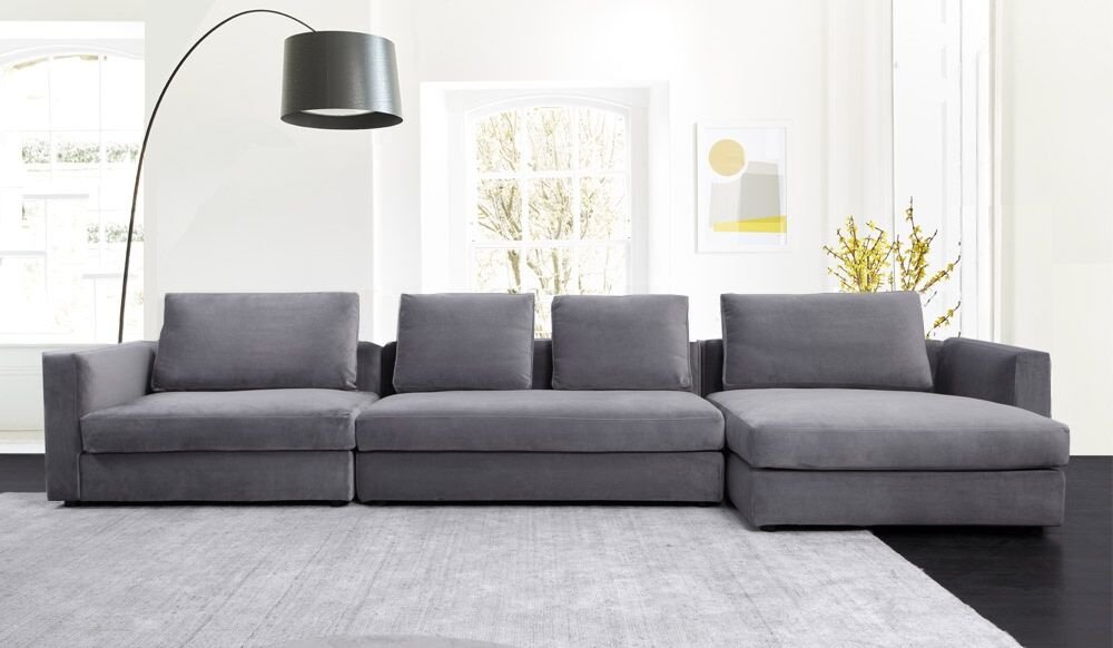 Spacious L-shaped sectional sofa with chaise lounge.