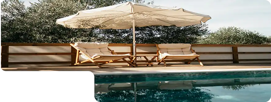 Modern outdoor chairs with wooden frame and grey cushions for patio seating.