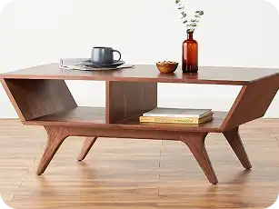 Black modern coffee table with open shelves for stylish living room setup.