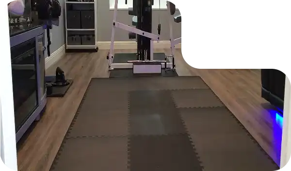 Soft foam gym mats laid out in a home workout space, ideal for sit-ups, yoga, and stretching routines.